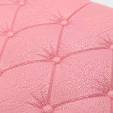 Peel-and-stick pink wallpaper with a 3D geometric pattern