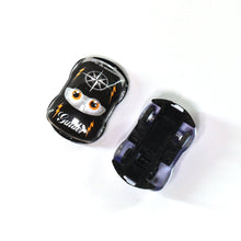 Mini pull back cars arranged for children’s play, featuring various colors.
