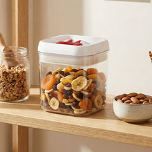 Clear storage box with secure red lid