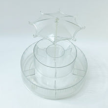 Spinning makeup and jewellery holder