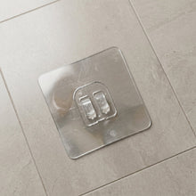 Wall hook holding keys and small accessories