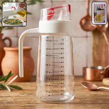 Glass Oil Dispenser Bottle 500ml on Kitchen Counter with Usage Inset Showing Oil Pouring and Side Handle Grip Close-up